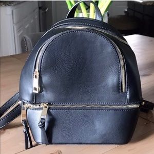Cute basic black backpack.